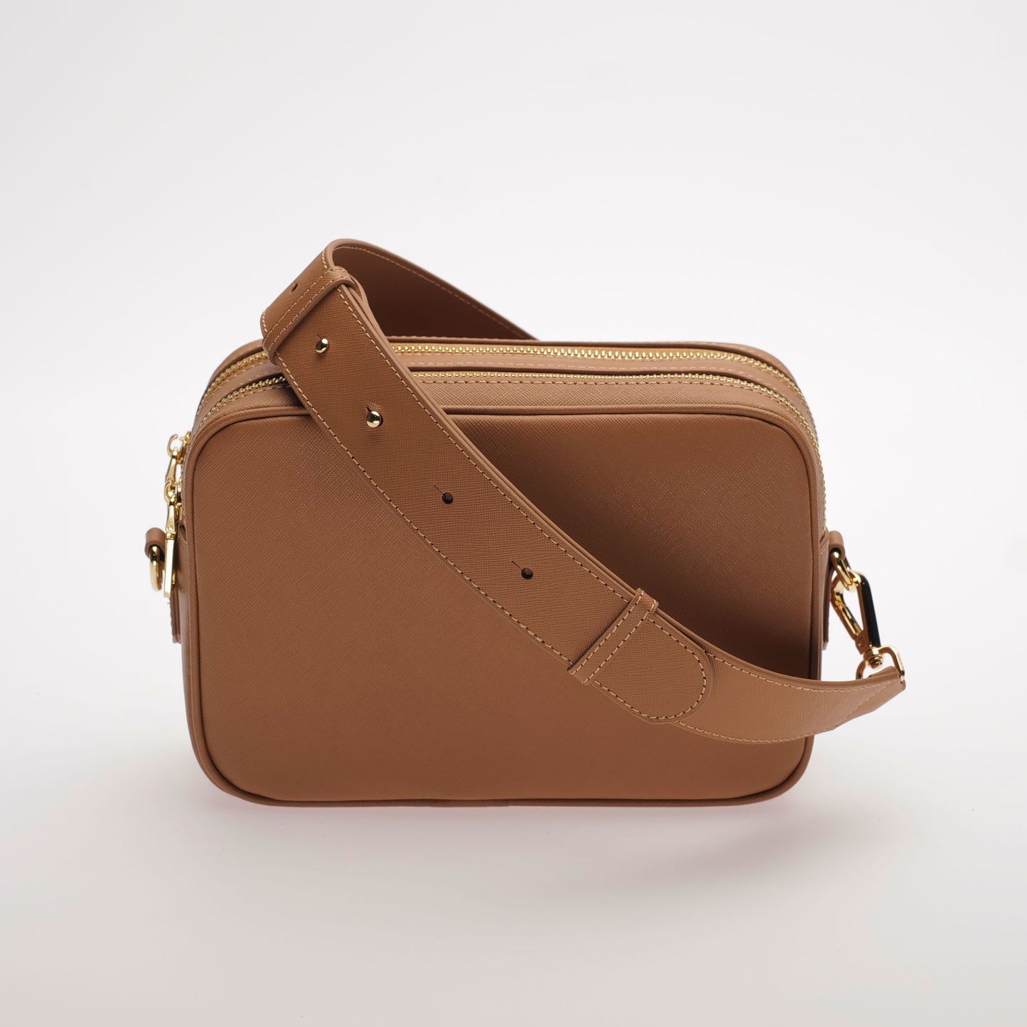 The James Saffiano Leather Crossbody Bag in Dusky Rose Tan by Swoon London