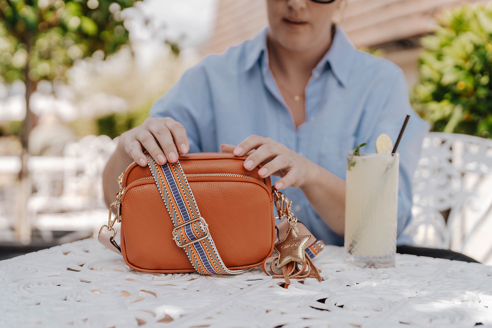 Swoon London Downton Bag in Sunset Orange on Table